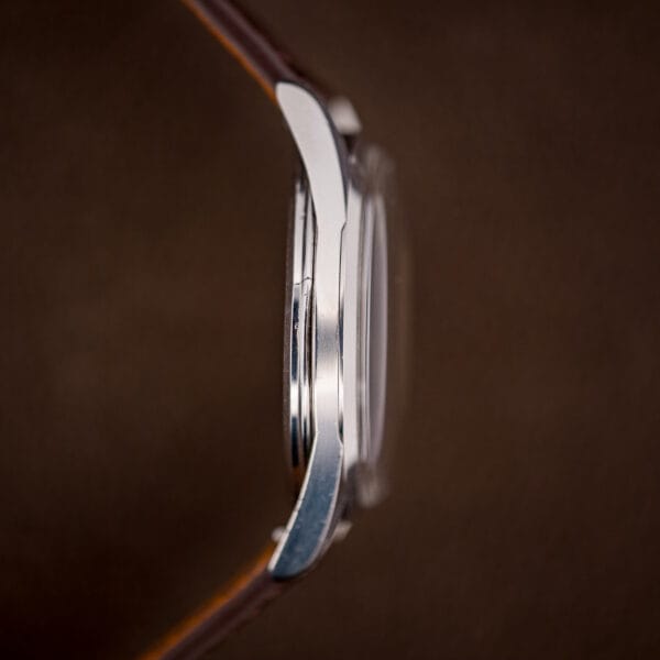 Omega Seamaster 2937-5 case profile showing tall domed acrylic crystal and polished stainless steel band