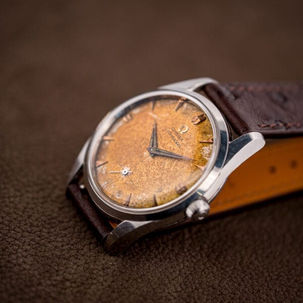 Omega Seamaster 2937-5 tropical dial, deep amber center fading to pale rim, dauphine hands on ostrich strap