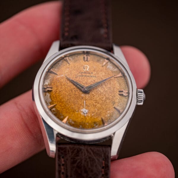 Omega Seamaster 2937-5 tropical dial in hand with amber and olive foxing, double baton and dauphine hands