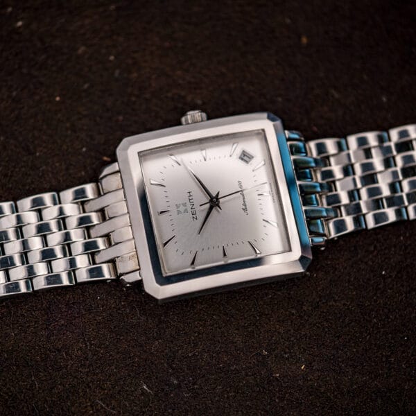Square steel Zenith Elite case and silver sunburst dial, angled view