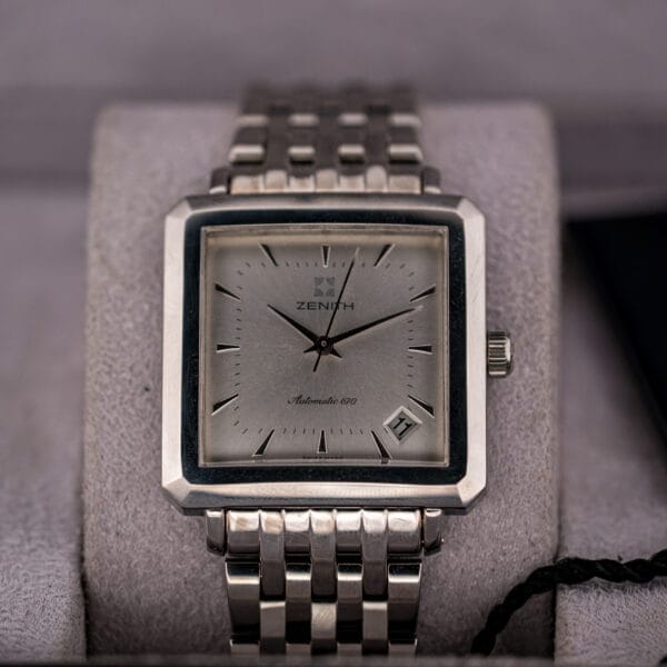Vintage Zenith Elite 670 front view on dark ground, square steel case