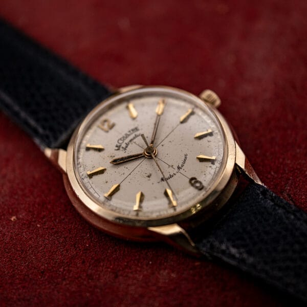 LeCoultre Master Mariner 395C463 in 14k gold, angled view showing the fluted crown, cream dial and sculpted claw lugs
