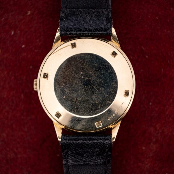 LeCoultre Master Mariner caseback exterior stamped 14K GOLD, showing honest surface wear and six case-wrench notches