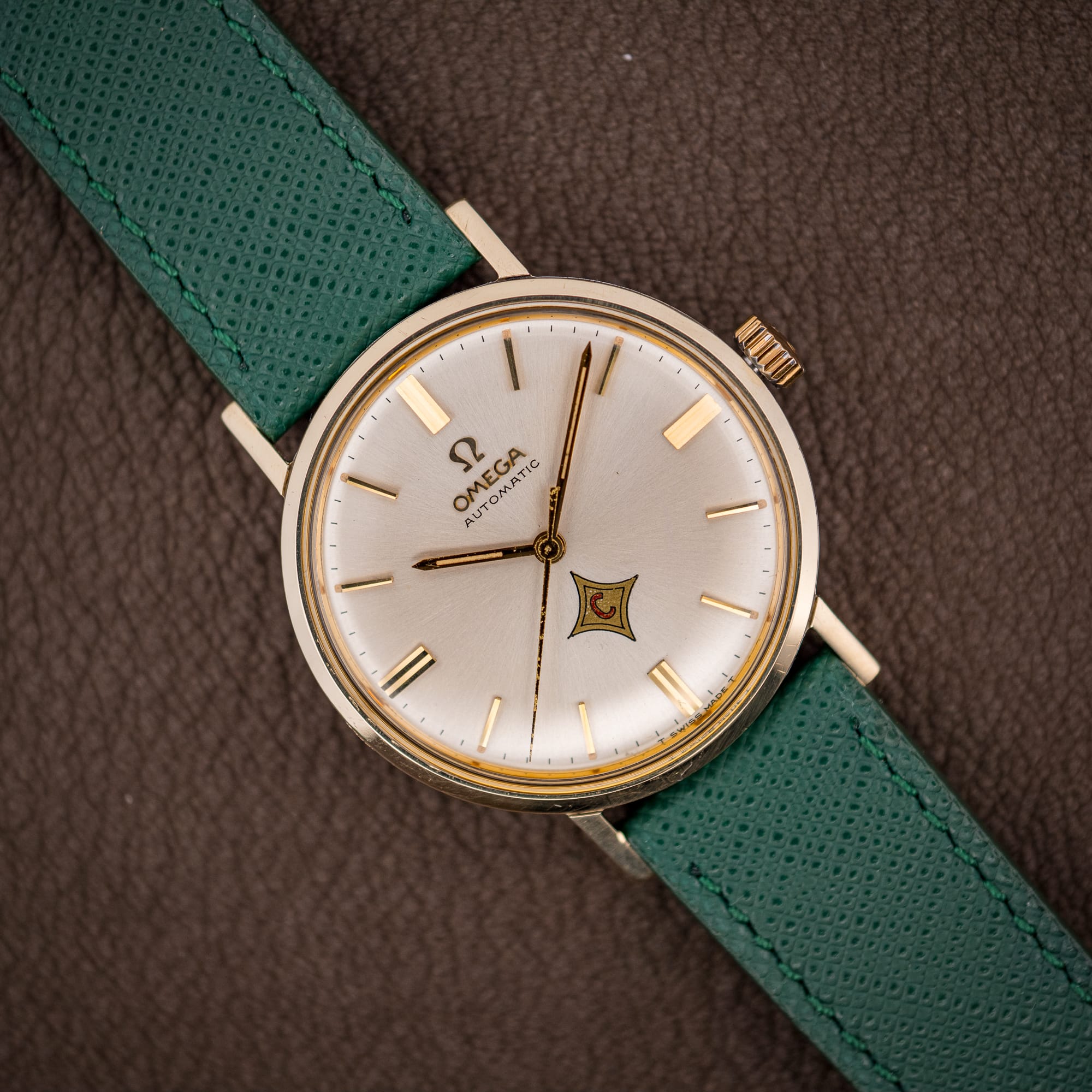 DSCF5184 Vintage Omega Automatic ref. 14765 silver dial with applied gold batons and red-C logo cartouche on pine green strap