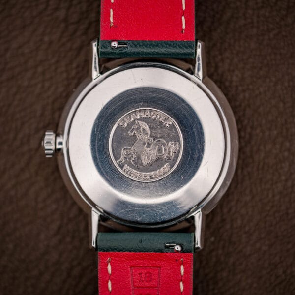 Omega Seamaster seahorse medallion caseback stamped Seamaster and Waterproof, with honest surface wear from decades of use.