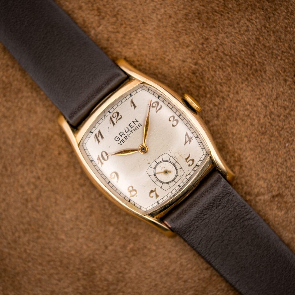 Vintage Gruen Veri-Thin ref 421-653 with cream dial and gilt Arabic numerals in a yellow gold filled tonneau case