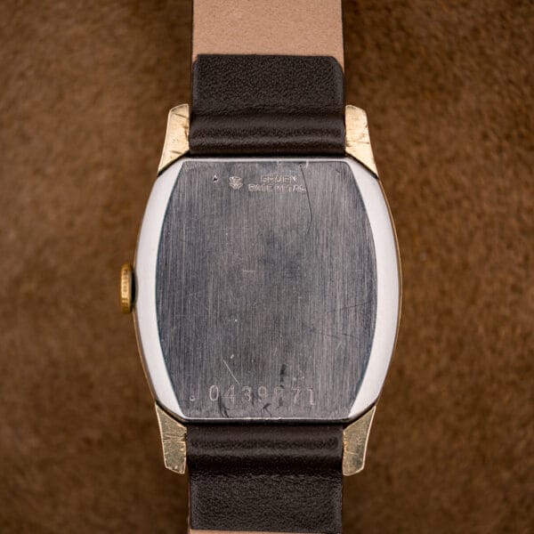 Gruen Veri-Thin caseback stamped GRUEN BASE METAL with crown-shield logo and serial number 0439871