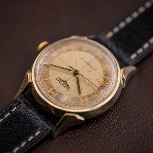 Longines Automatic Ref. 2030 angled dial view with tropical foxing across the center and applied gold numerals