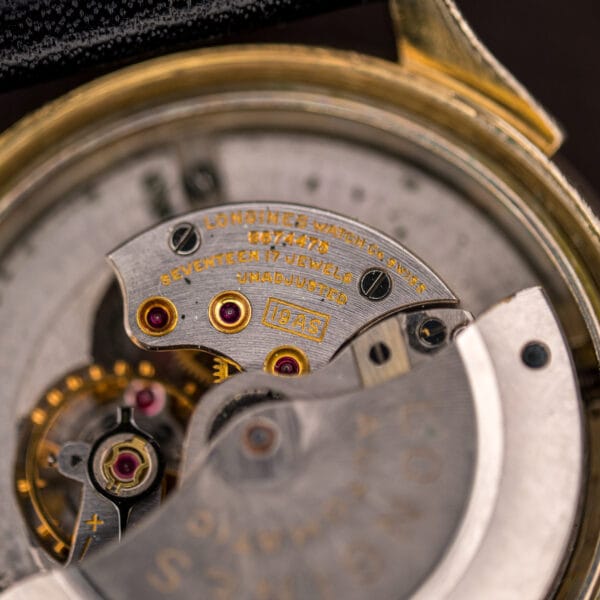 Longines 19AS movement bridge stamped LONGINES WATCH Co. SWISS, SEVENTEEN 17 JEWELS, UNADJUSTED and caliber 19AS