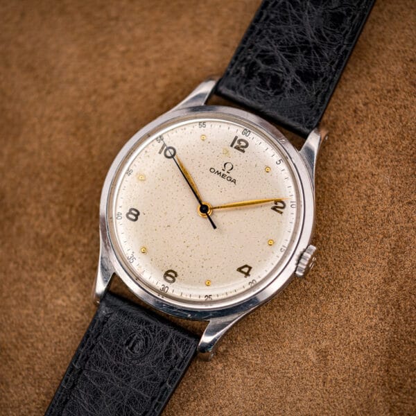 Omega Jumbo 2256/1 at a three-quarter angle showing the signed Omega crown and blued central seconds hand