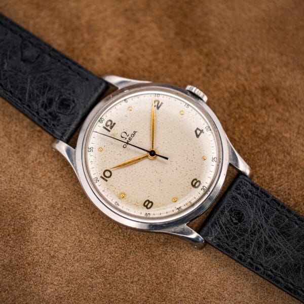 Low-angle view of the Omega 2256/1 Jumbo with the blued sweep seconds crossing a warmed silvered dial