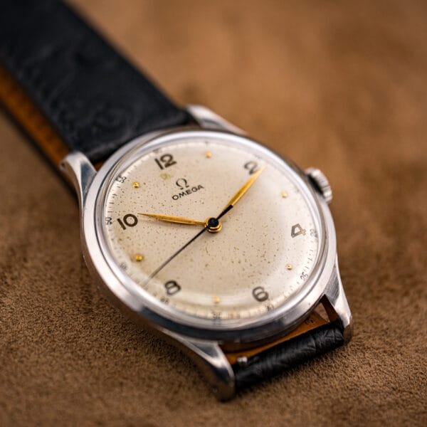 Three-quarter Omega Jumbo 2256/1 with signed crown at three and gilt leaf hands on a cream dial