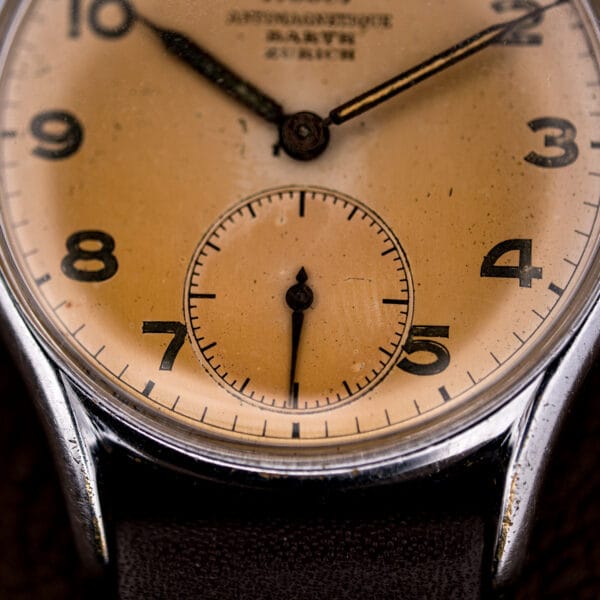 Close-up of the Tissot 6439-2 running seconds subdial at six, aged salmon finish with light speckling.