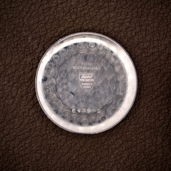 Inner caseback of the Tissot stamped FOND ACIER INOXYDABLE and reference 6439-2 with the Tissot shield.
