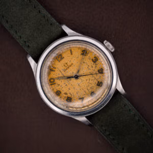 Vintage 1944 Omega Ref. 2179/4 with a tropical caramel dial and luminous Arabic numerals