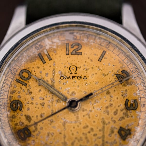 Omega 30T2 SC dial with full luminous Arabic numerals and a blued central sweep seconds hand