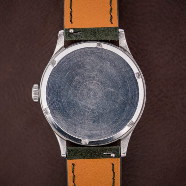 Brushed stainless steel caseback of the vintage Omega Ref. 2179/4, unengraved