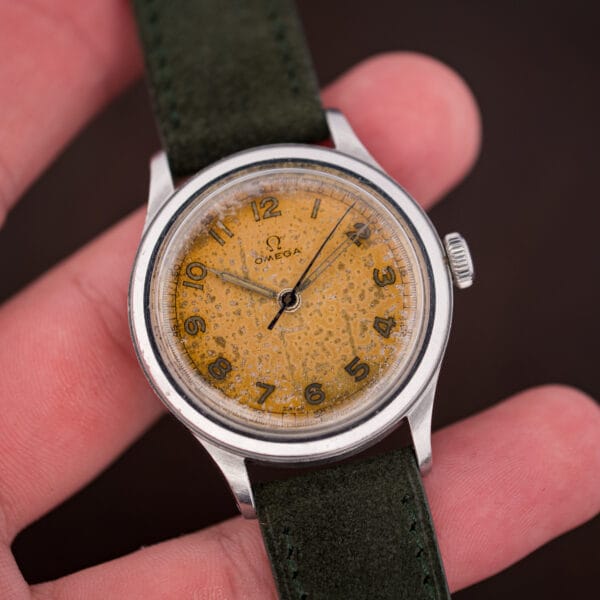 1944 Omega 2179/4 tropical dial viewed at an angle in natural light