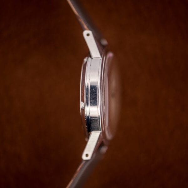 Profile of the slim stainless Veri-Thin case with faceted lugs and light honest wear.