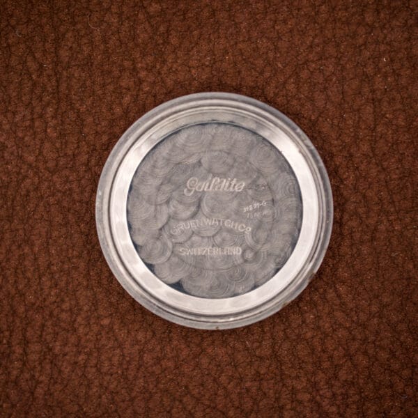 Inner case back stamped Guildite, Gruen's stainless alloy, with case reference and GRUEN WATCH Co SWITZERLAND.