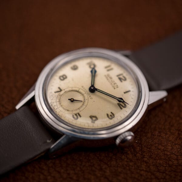 Vintage Gruen Precision Autowind on a brown leather strap, domed crystal over a softly aged dial.