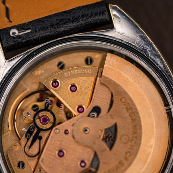Macro of the Omega 751 movement bridge stamped 751 with serial 31236958, showing jewels and gilt finishing.