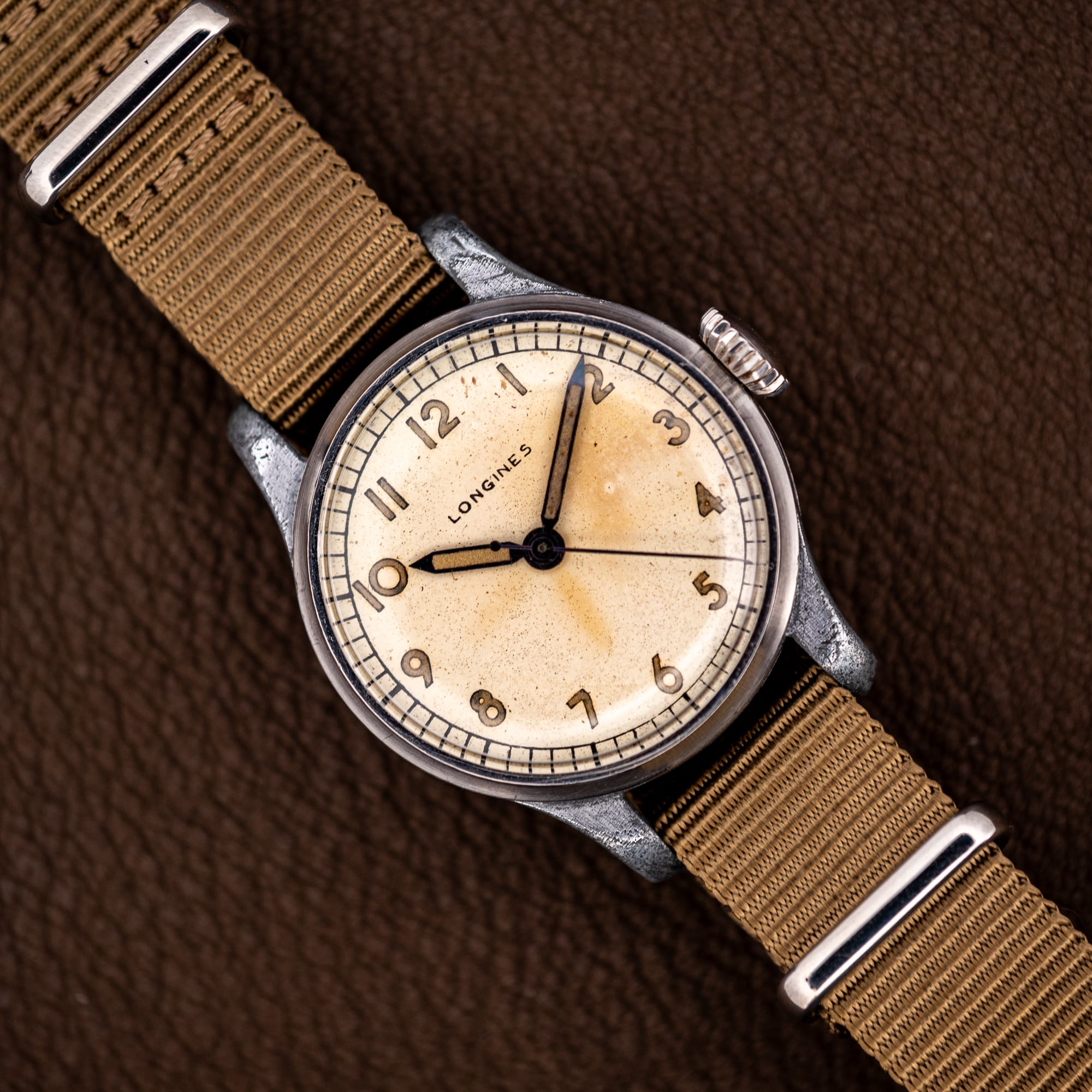 DSCF5373 Vintage Longines caliber 12L field watch, cream dial with luminous Arabic numerals, on a khaki nylon strap