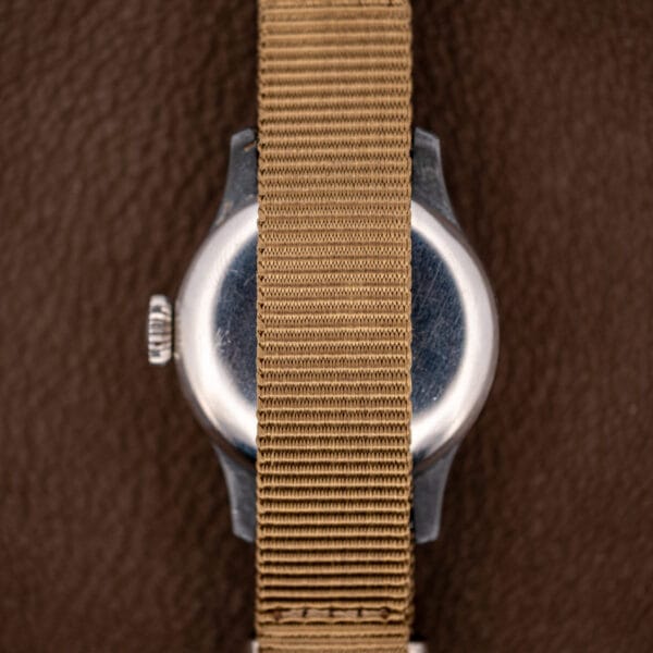 Longines field watch plain stainless caseback with spring bars, no military issue markings, on khaki strap