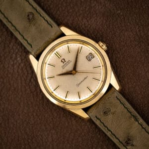 Omega Seamaster 166.010 gold capped case with silver sunburst dial, applied gold batons and date at three