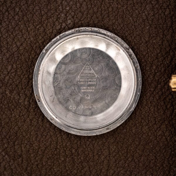 Inner caseback of the Omega 166.010 stamped OMEGA WATCH CO, FAB. SUISSE, FOND ACIER INOXYDABLE and CD 166.010