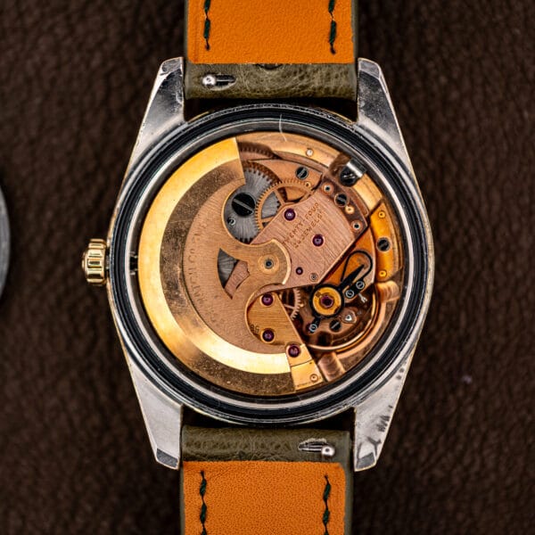 Rose gilt Omega caliber 562 automatic in the case, rotor signed OMEGA WATCH Co SWISS beside the jewelled bridges