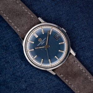 Vintage Eterna-Matic 1000 with midnight blue sunburst dial, five-dot logo and applied baton markers, front view.