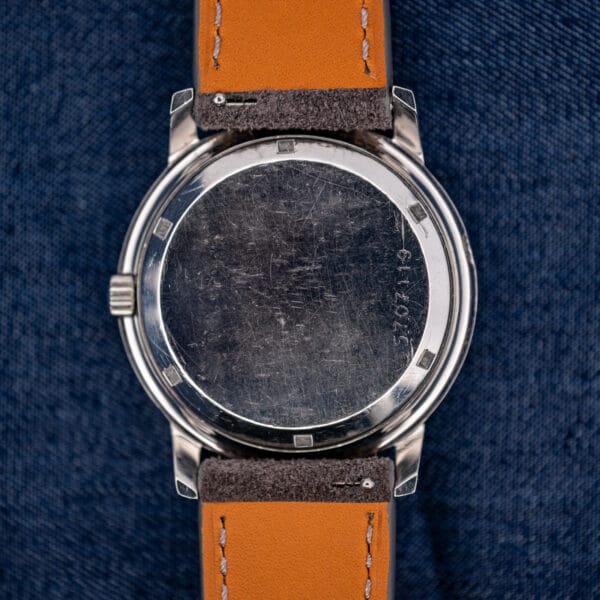 Exterior stainless caseback of the Eterna-Matic 1000, brushed with honest wear and an engraved case number.