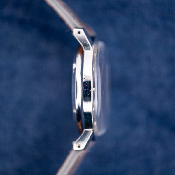 Opposite case flank of the vintage Eterna 1000, polished stainless steel with honest hairlines and faceted lugs.
