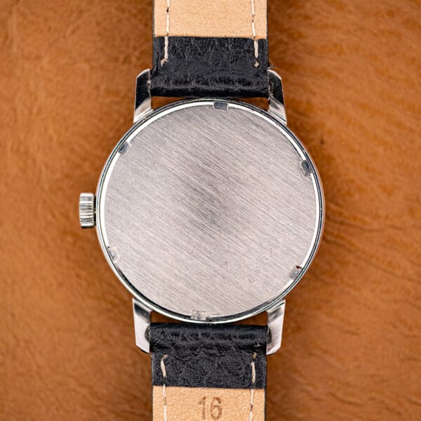 Brushed stainless caseback of the Eterna Vision, plain and unengraved on the outside.