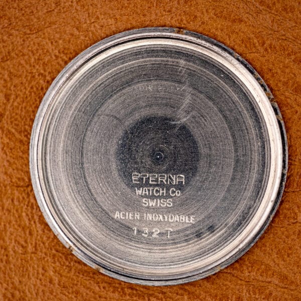 Inside of the caseback stamped ETERNA WATCH Co, SWISS, ACIER INOXYDABLE, and reference 132 T.