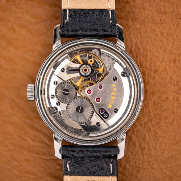 Hand-wound Eterna caliber 1407U in the case, ETERNA signed bridge in gold with ruby jewels.