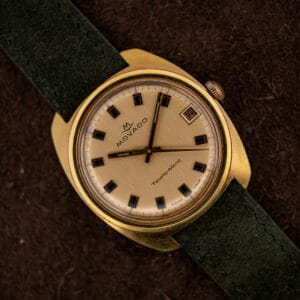 Movado Tempomatic Sub-Sea 138-625-502 champagne linen dial with gold framed baton markers and date at three