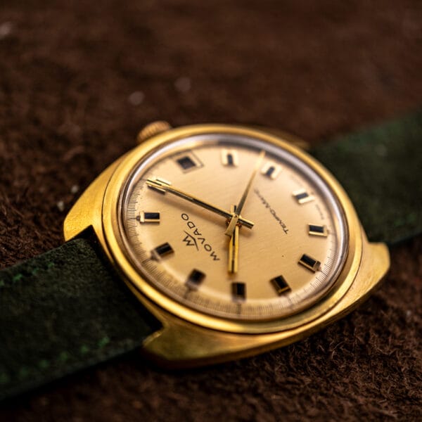 Inverted view of the Movado Tempomatic, showing cushion case depth and the domed crystal edge