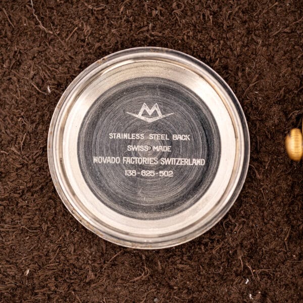 Caseback interior of this Movado stamped STAINLESS STEEL BACK, MOVADO FACTORIES SWITZERLAND and reference 138-625-502