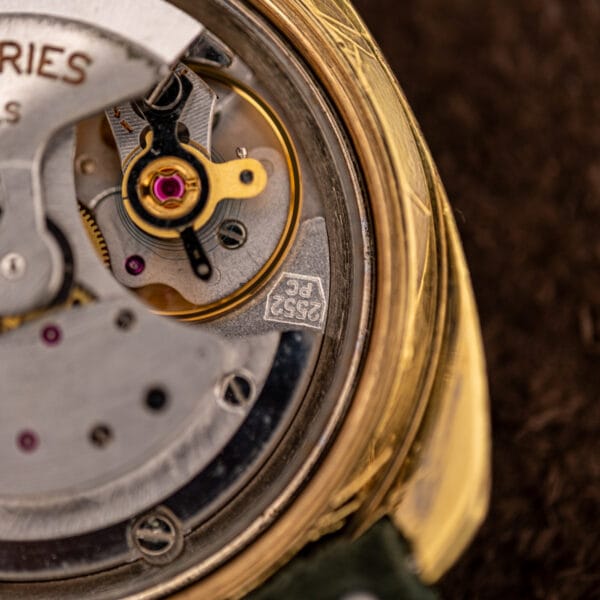 Caliber 2552 PC stamped in its hexagonal cartouche beside the balance of this Movado