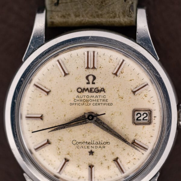 Omega Constellation Calendar dial macro showing the AUTOMATIC CHRONOMETRE OFFICIALLY CERTIFIED printing and applied baton indices