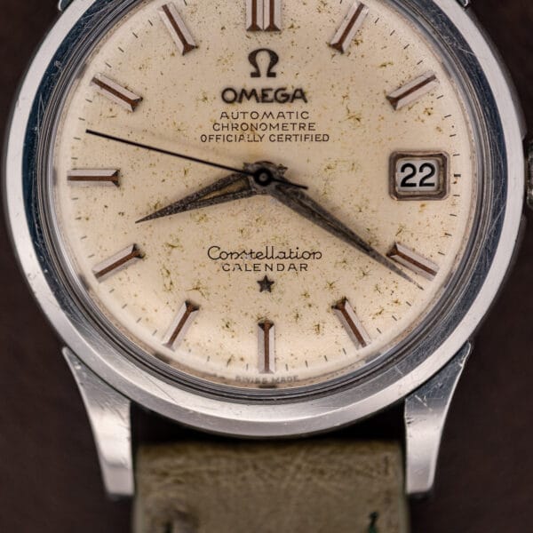 Constellation Calendar script and star above six on the off-white cal. 504 dial, SWISS MADE printed at the base