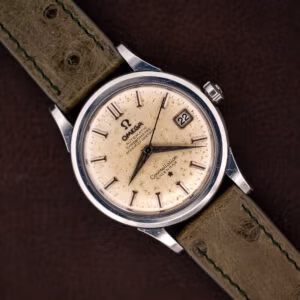 Omega Constellation 2943-2 top down on olive ostrich strap, off-white speckled dial with date at three
