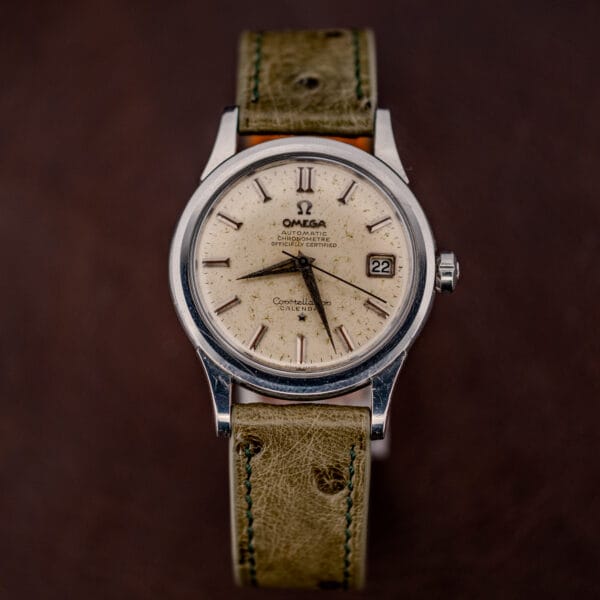 Full length view of the Omega Constellation 2943-2 with its olive ostrich strap and green stitching
