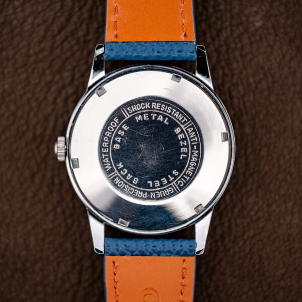 Steel snap caseback stamped Gruen Precision, base metal bezel, waterproof, shock resistant and anti-magnetic.