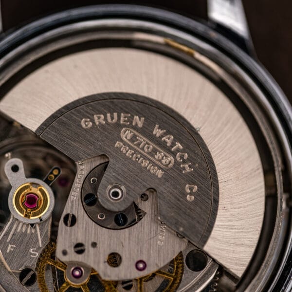 Inside of the snap caseback stamped Watch Case Corp, made in Hong Kong, with a case reference number.