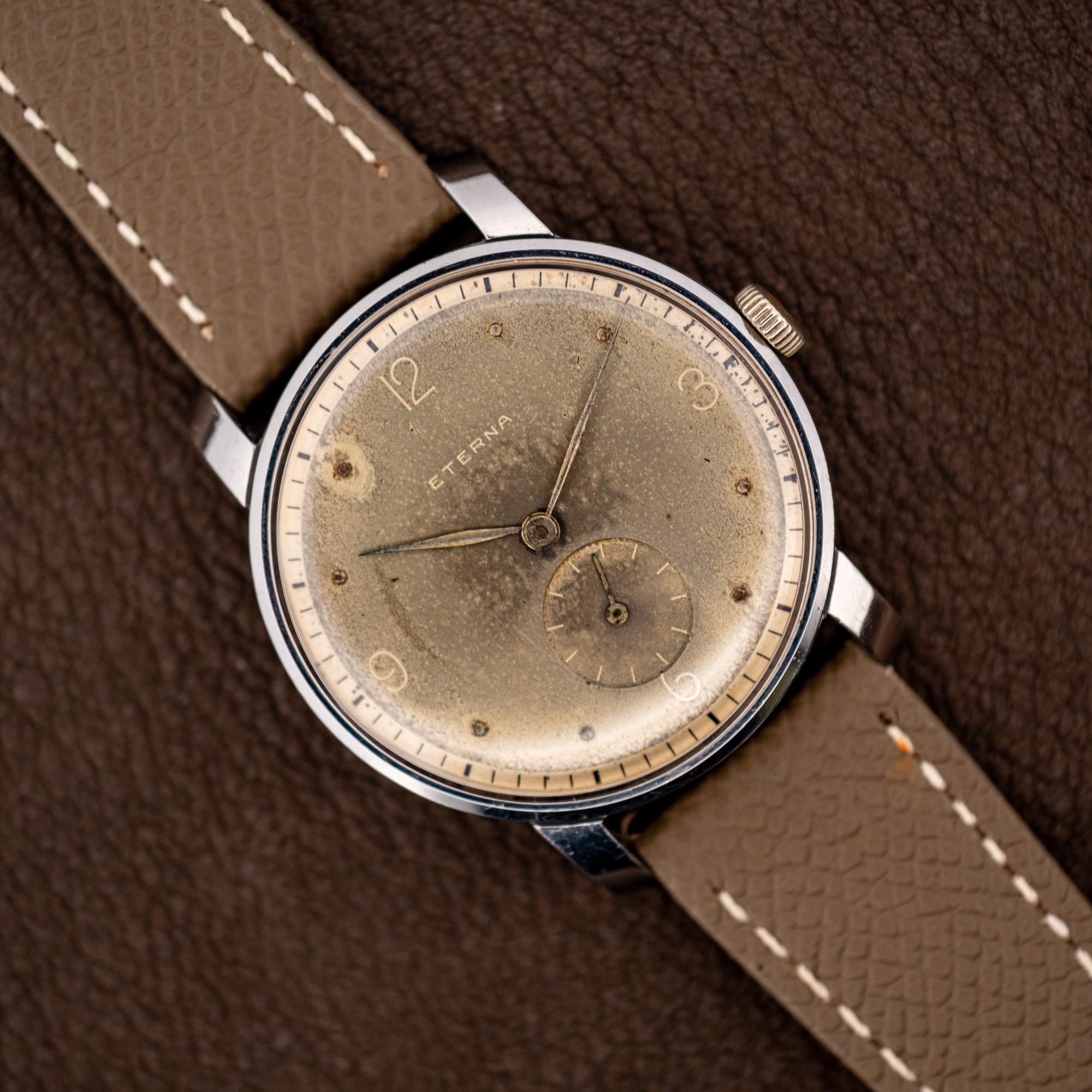 DSCF5530 Vintage Eterna 34mm dress watch angled on taupe leather, taupe patinated dial with small seconds at six