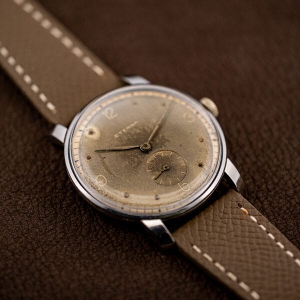 Eterna Cal. 965 dress watch three-quarter view with fine, even taupe dial patina and cream chapter ring