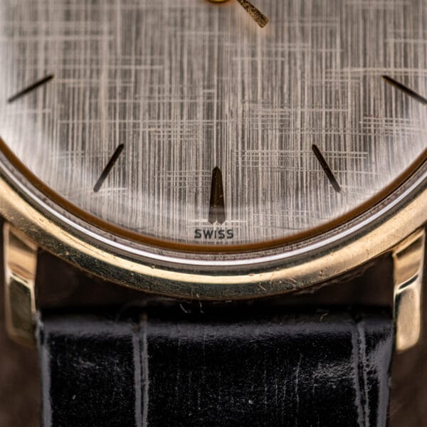 Girard Perregaux Gyromatic lower dial with SWISS printed at six above the gold filled bezel and acrylic crystal